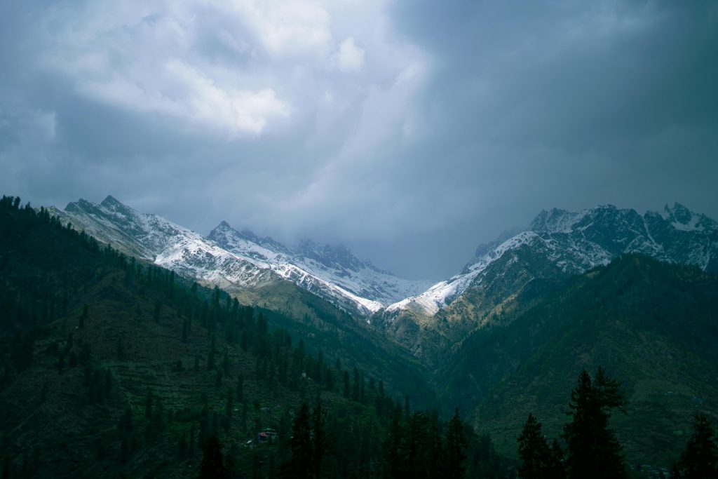 Scenic view of the dramatic and snowcapped mountains in Manali, India.